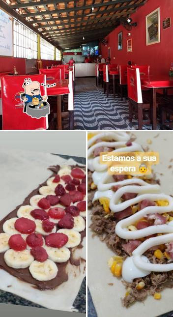 A imagem do Restaurante Cantinho da Vovó’s comida e interior