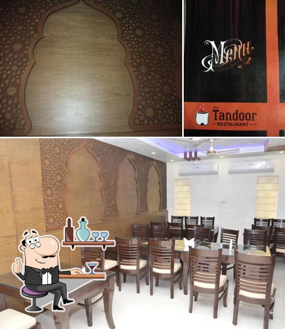 Check out the picture depicting interior and exterior at The Tandoor Restaurant