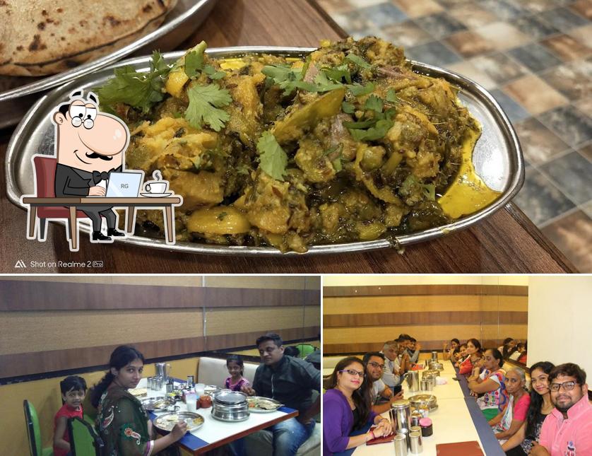 Check out the picture depicting interior and food at Shree Khodiyar Kathiyawadi Dhaba - Ankleshwar