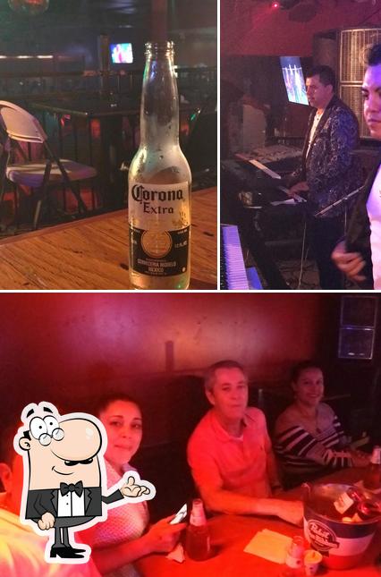 Check out the photo showing interior and beer at Las Nenas Billiards & Restaurant