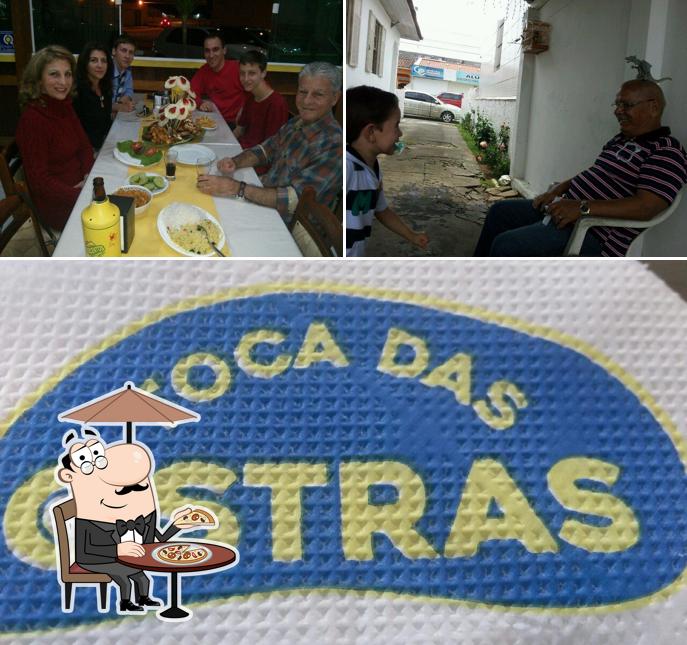 A imagem da exterior e comida no Petiscaria Toca das Ostras