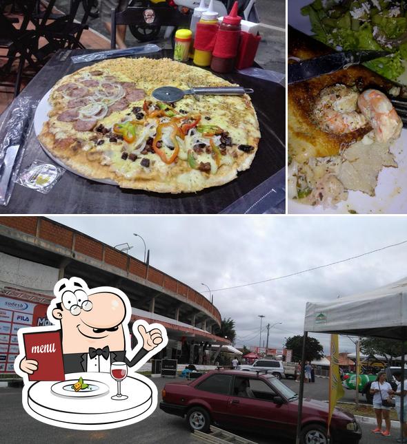 Dê uma olhada a foto apresentando comida e exterior a Deli Pizza