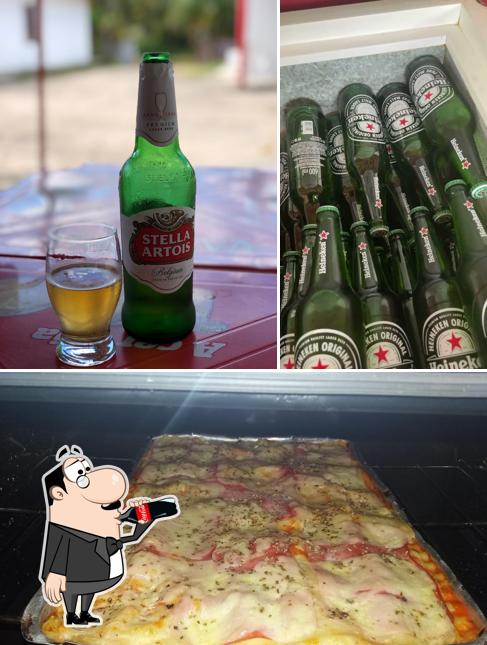 A foto do Bar Das Coroas’s bebida e pizza