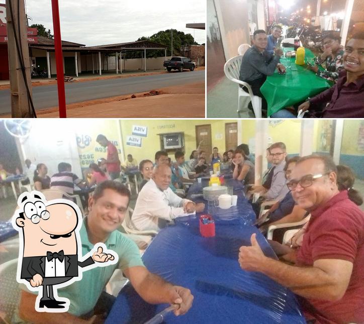 A imagem da interior e exterior no Pizzaria Bigness