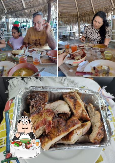 This is the image showing dining table and meat at El trompo