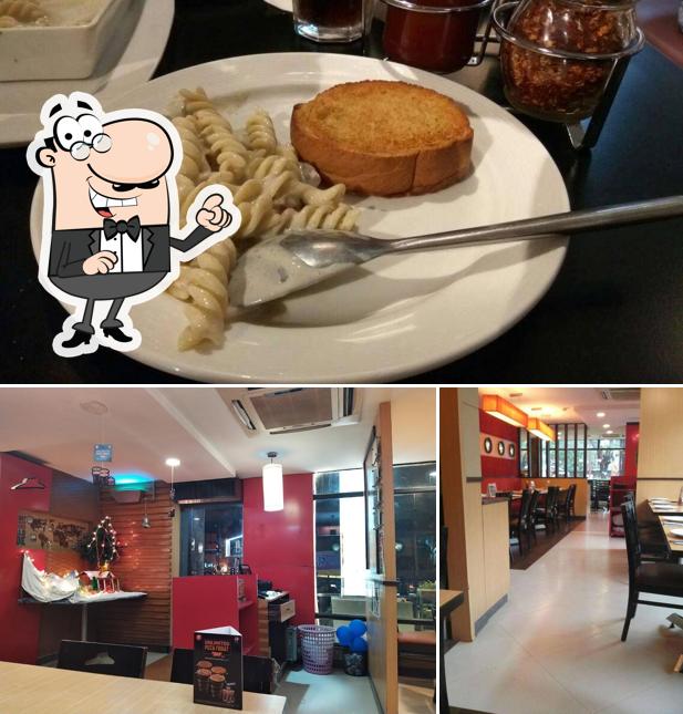 Take a look at the picture depicting interior and food at Pizza Hut