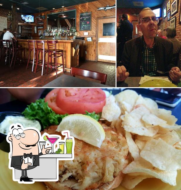 The picture of bar counter and food at Waterman's Grill