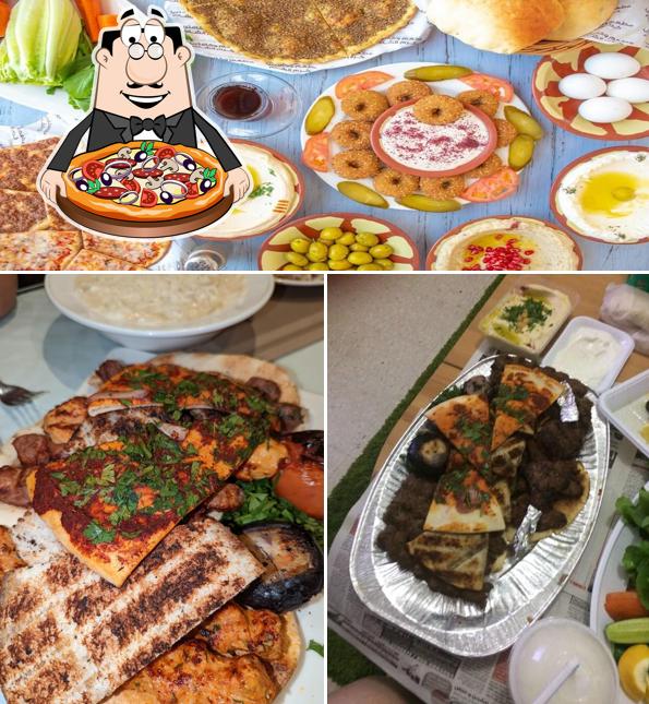 Get pizza at Karam Al Sham Restaurant