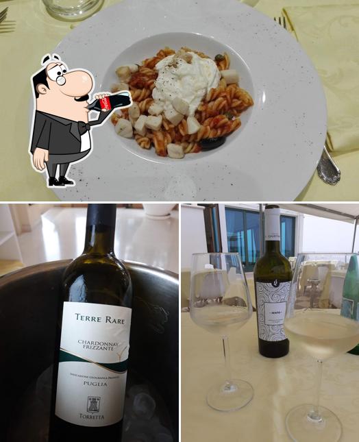 Dai un’occhiata alla immagine che presenta la bevanda e cibo di Ristorante Zio Tom