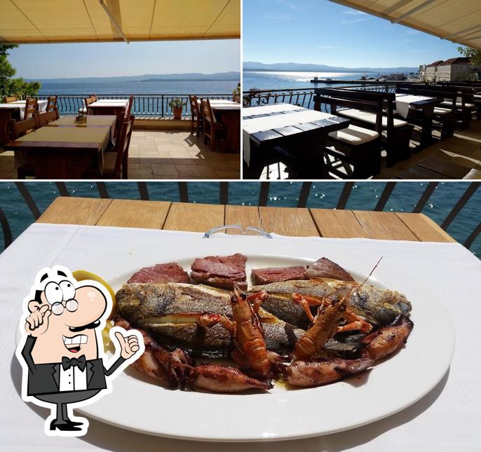 Dai un’occhiata alla immagine che presenta la interni e cibo di Restaurant Santo