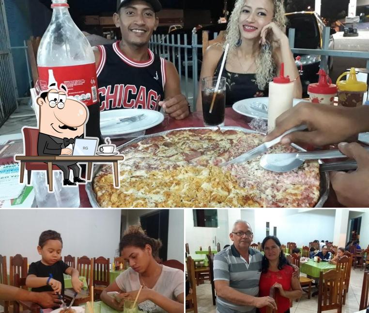 Sente em uma das mesas no Pizzaria e Pastelaria Lago Verde-Ginasio