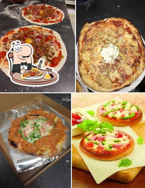 A Pizzeria Massimo, vous pouvez prendre des pizzas