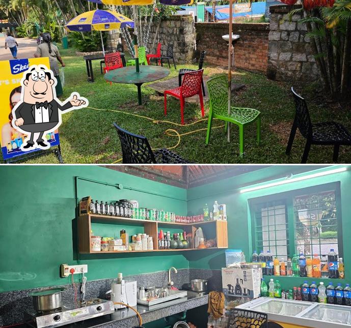 Take a seat at one of the tables at Honeyhills cafeteria thenmala ecotourism