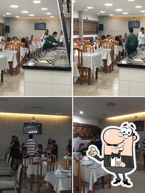 Sente em uma das mesas no Pizzaria e Hamburgueria Santos Dumont