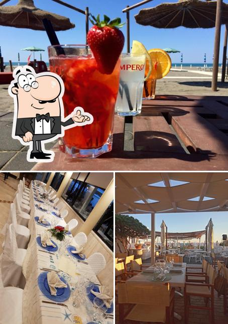 La foto di interni e bevanda da Ristorante Maremma sul Mare