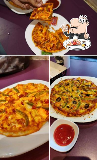 Try out pizza at Whatta Waffle!