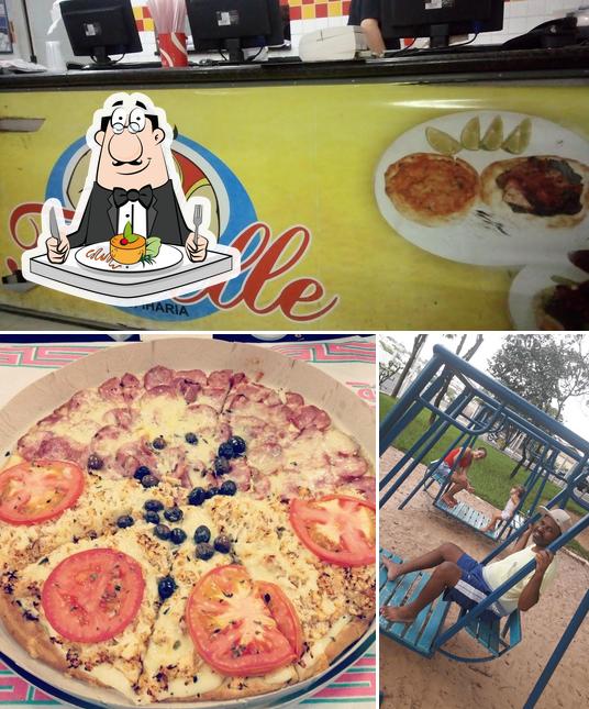 A foto da comida e área de lazer a Tortelle pizzaria