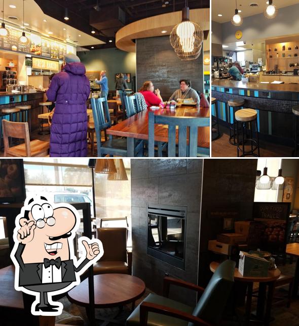 Take a seat at one of the tables at Einstein Bros. Bagels