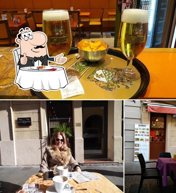 Dai un’occhiata alla foto che presenta la tavolo da pranzo e birra di Ellisse Cafè Padova