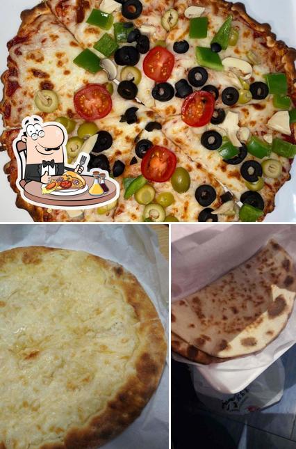 Order pizza at Al Yakkht Pastry & Cafeteria معجنات اليخت