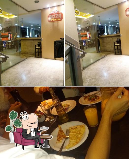 A imagem da interior e comida a Pizza Plaza