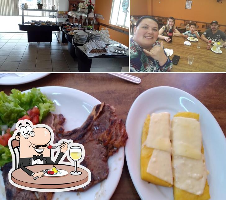 Confira a imagem mostrando comida e mesa de jantar no Restaurante E Lanchonete Itaqui