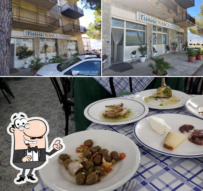 Фотография, на которой видны внешнее оформление и еда в Trattoria Nasca 2 Cerda