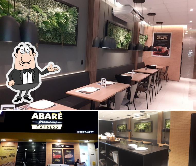 Sente em uma das mesas no Abaré Pizzarias - Express Capão Raso