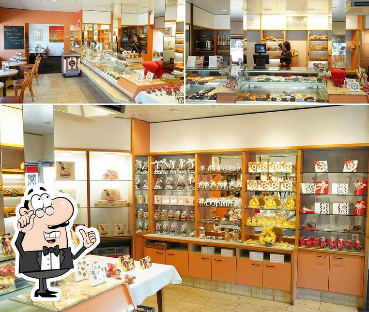 Guarda la foto che raffigura la interni e cibo di Sutter Begg – Bäckerei, Konditorei & Café