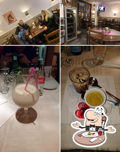 This is the image showing dining table and drink at Café Restaurant des Alpes