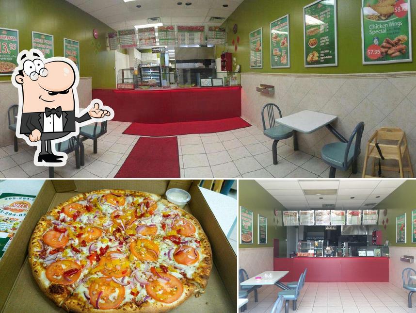 Parmi les diverses choses de la intérieur et la pizza, une personne peut trouver sur Mecca Pizza And Wings