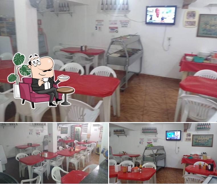 Посмотрите на внутренний интерьер "Natal Bar e Restaurante"
