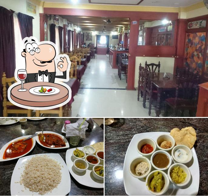 Check out the image showing food and interior at Kuttanadan Restaurant