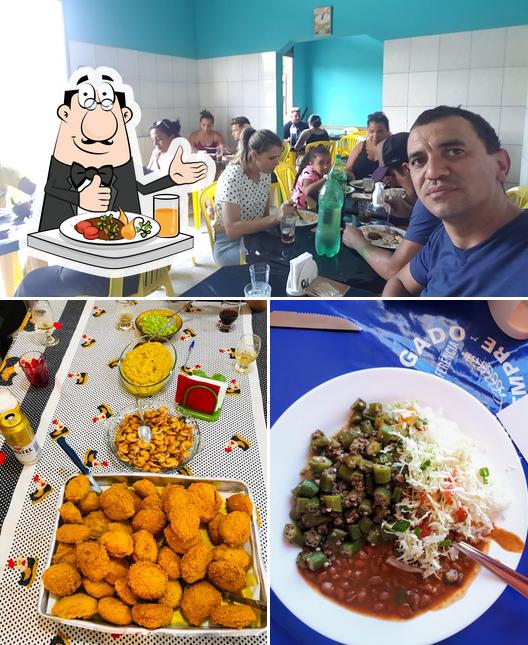 Entre diferentes coisas, comida e interior podem ser encontrados no Restaurante Multi Pratos