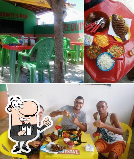 Take a look at the photo displaying interior and food at Requintes bar