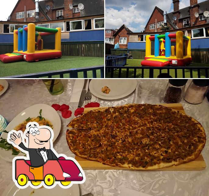 The photo of play area and pizza at The Osidge Arms