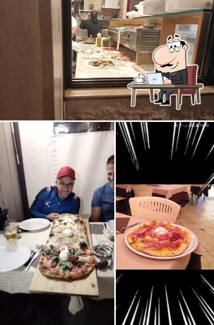 La foto della interni e tavolo da pranzo di Pizzeria Opera Prima