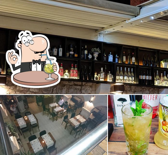 Dai un’occhiata alla foto che presenta la bevanda e interni di Passarola Restaurant