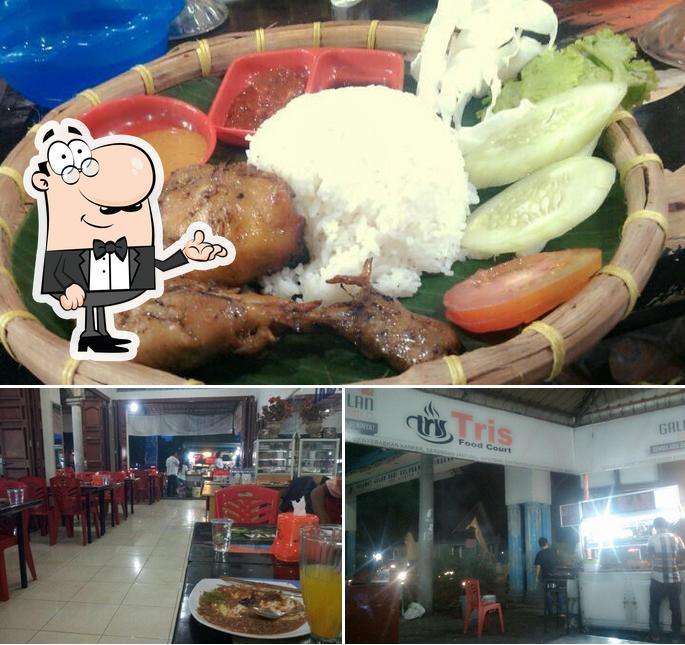 This is the image depicting interior and meat at Tris Food Court