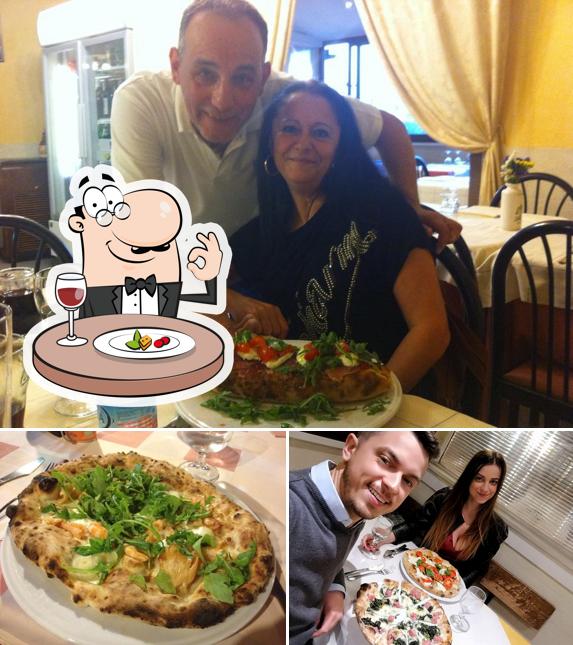 Check out the photo displaying food and interior at La Piccola Napoli