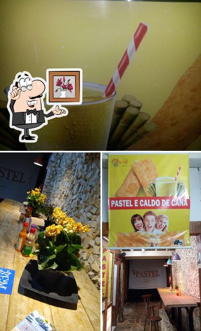 Confira a imagem mostrando interior e bebida a Pastel & Cia