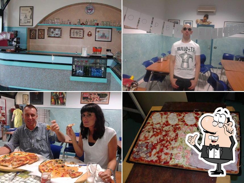 Dai un'occhiata agli interni di Lo Spicchio Di Pizza Pizza Al Taglio E Al Piatto