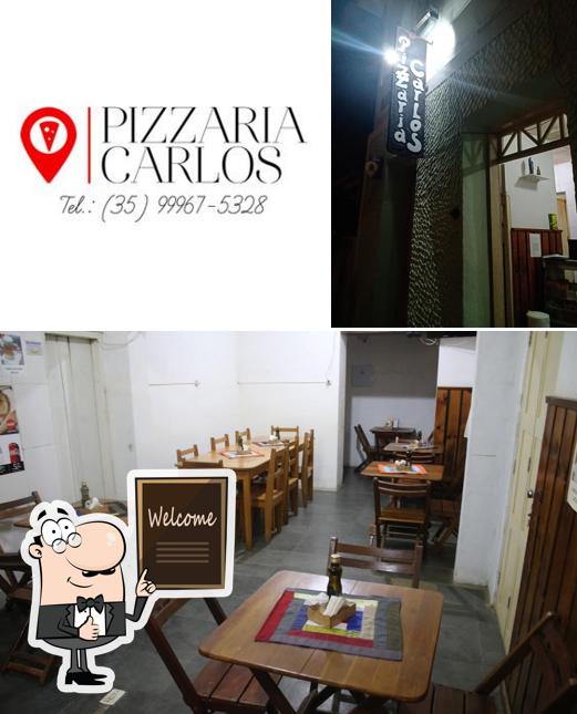 Look at this picture of Pizzaria Carlos