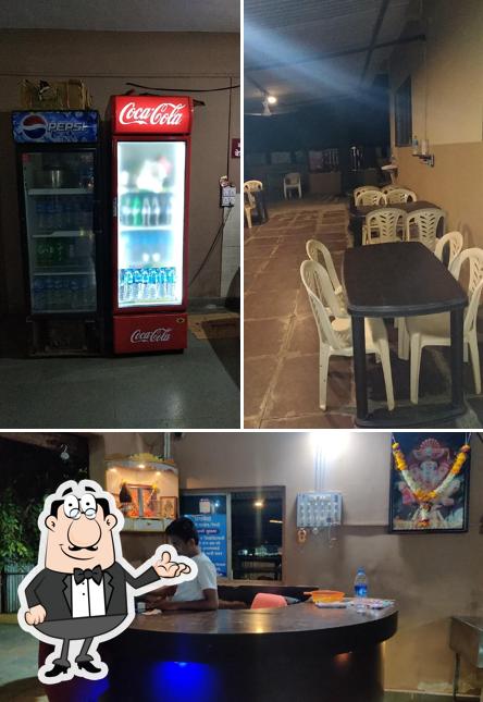 Take a seat at one of the tables at Prathamesh Hotel Khekda Special