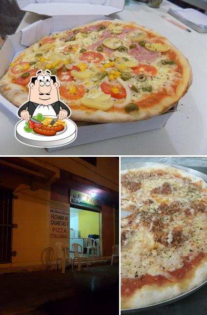 A imagem da comida e interior a Ki' Pizza