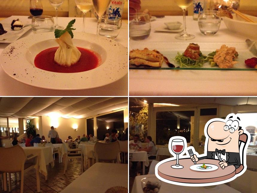 Confira a foto mostrando comida e interior no Restaurante Buzio