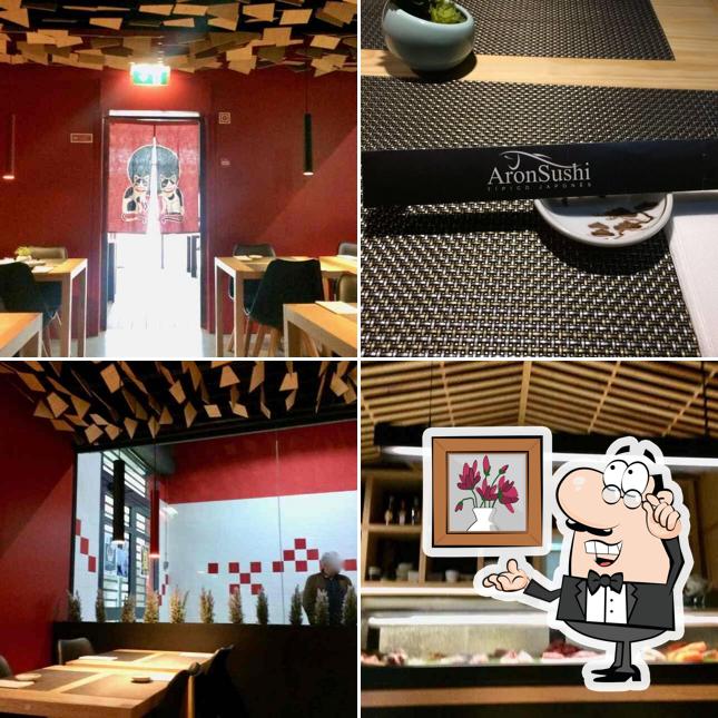 Take a seat at one of the tables at AronSushi Saldanha