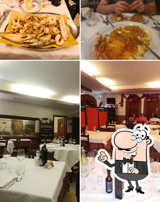 Installez-vous à l'une des tables de Trattoria Hotel Tappa Fissa