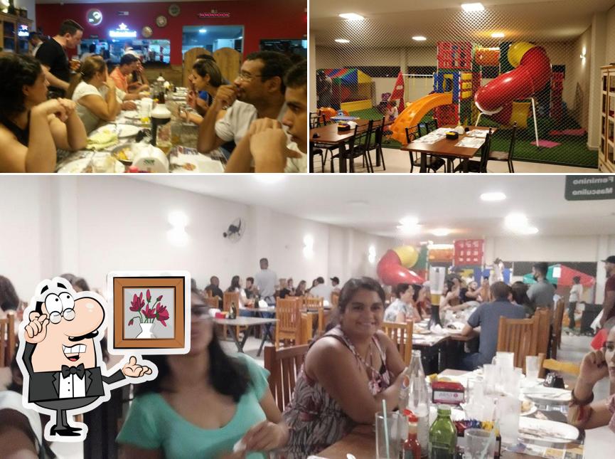 O interior do Pizzaria Don Carloni