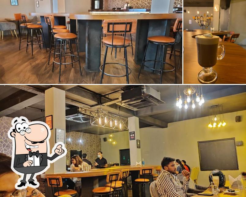 Among different things one can find interior and beverage at Urban Beans Cafe